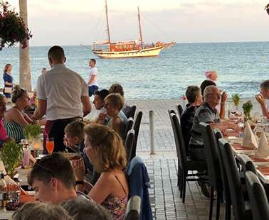 Enjoy delicious food in front of one of the most beautiful coasts of the Mediterranean