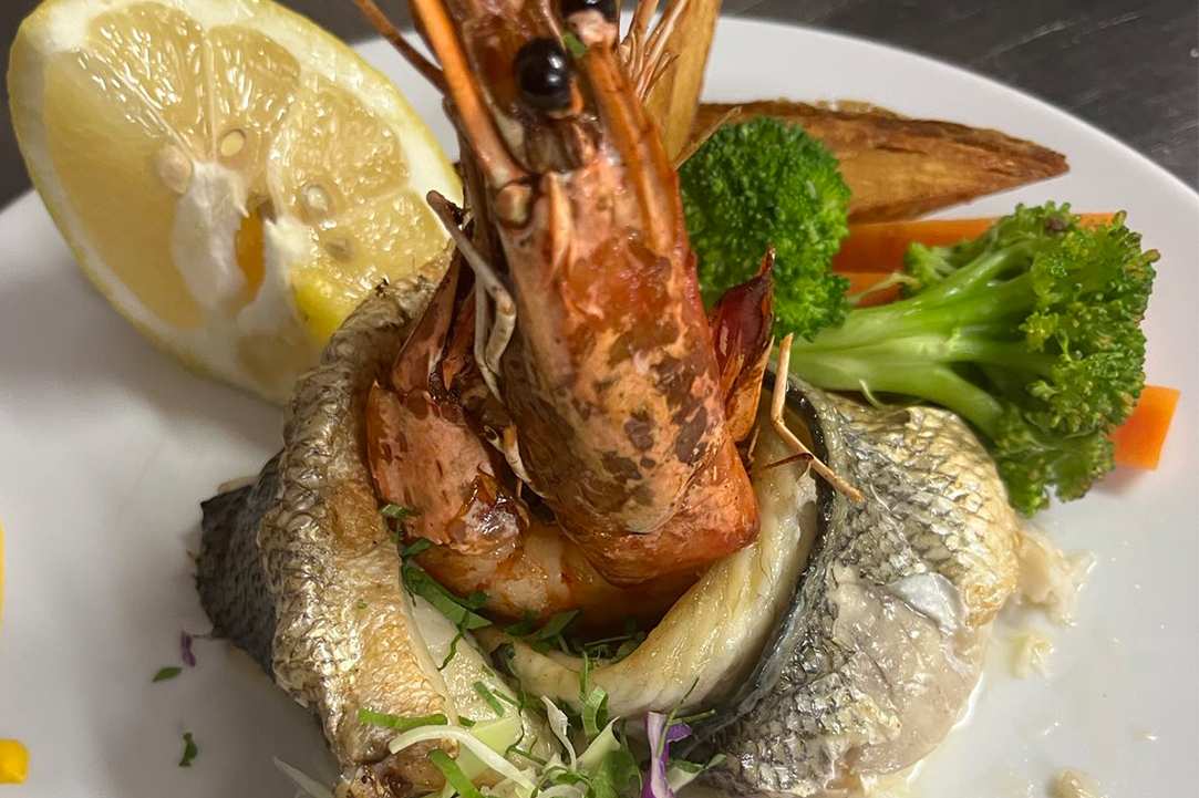 Enjoy delicious food in front of one of the most beautiful coasts of the Mediterranean