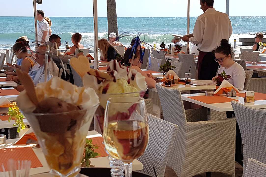 Enjoy delicious food in front of one of the most beautiful coasts of the Mediterranean