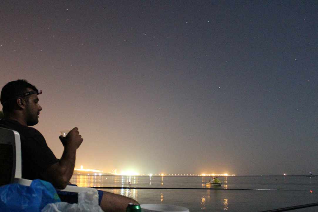 Fishing at night with the stars