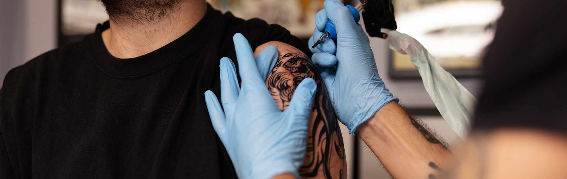 2 tattoo artists guide us into the modern world of tattooing